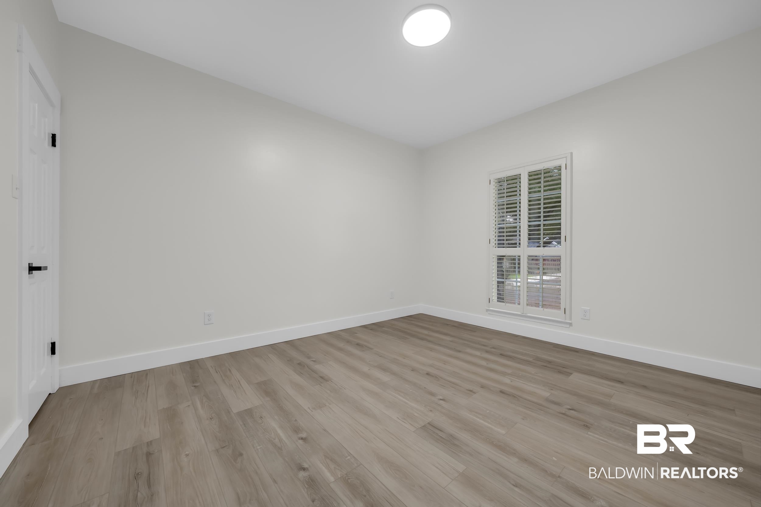 4924 Brooke Court Mobile, AL 36618 - Photo 26 of 34 Spare room with light wood-style flooring and baseboards