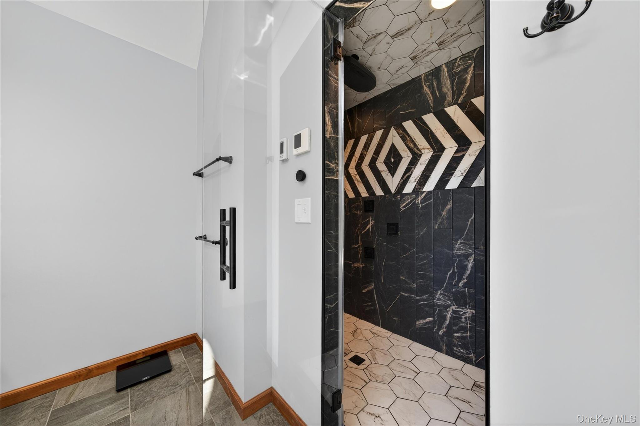 2 White Horse Road Middletown, NY 10940 - Photo 26 of 47 Recently renovated, the bathroom showcases a distinctive oversized tiled walk-in steam shower for a luxurious spa-inspired experience.
