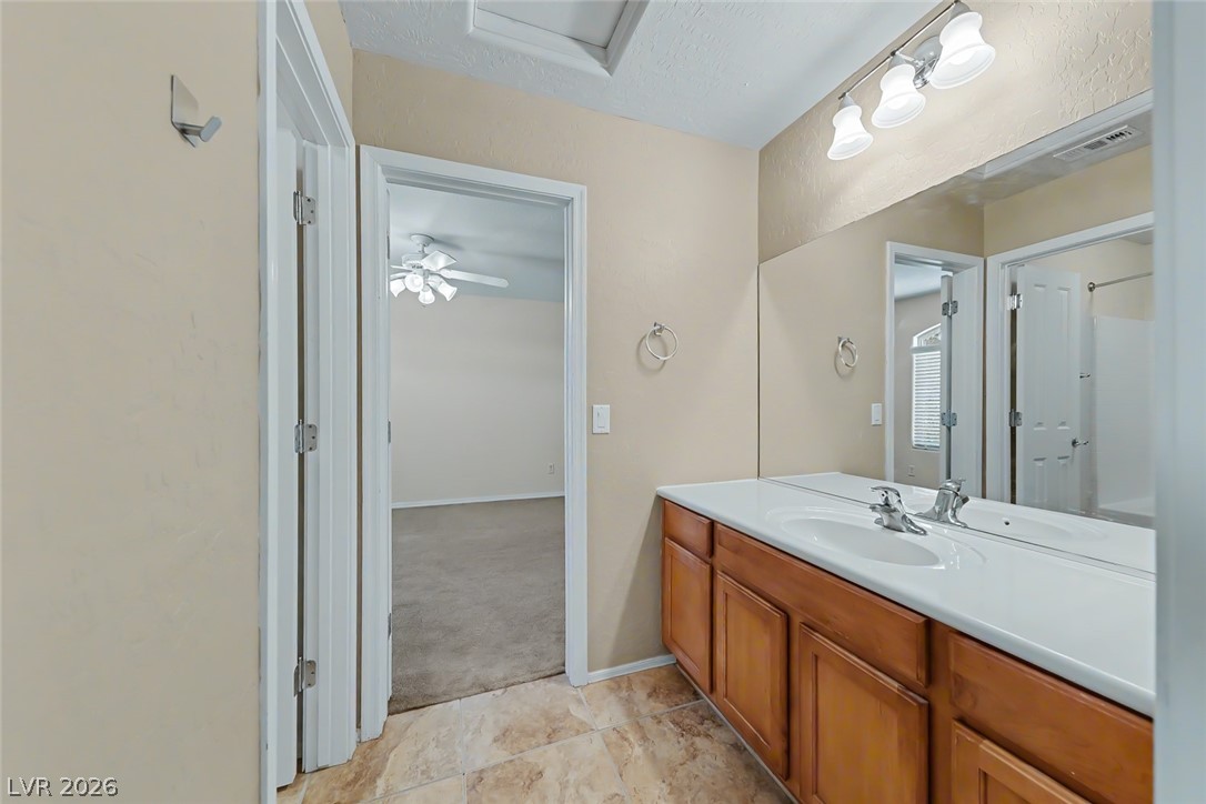 2356 Rue Bienville Way Henderson, NV 89044 - Photo 15 of 20 This bathroom features a double vanity and tile flooring for comfortable living.