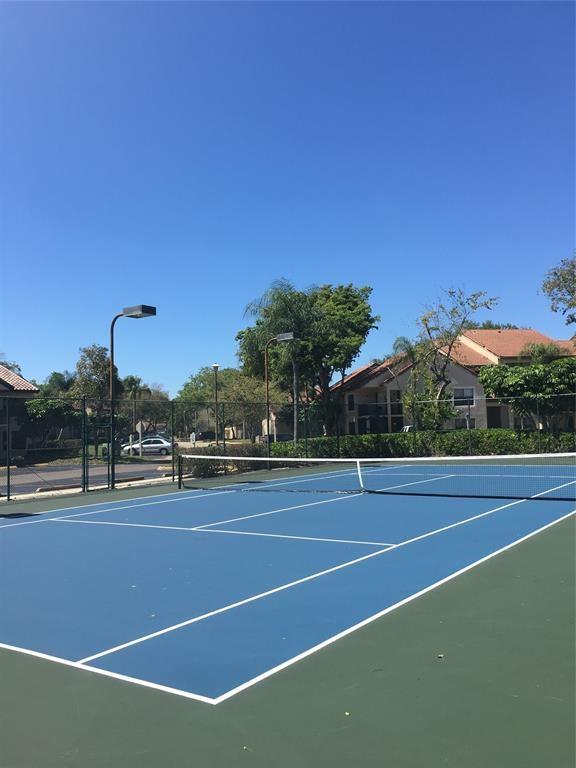 4521 West McNab Road, Unit 19 Pompano Beach, FL 33069 - Photo 29 of 29 a view of a tennis court