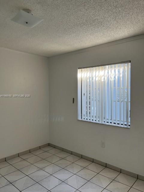 961 West 44th Street Hialeah, FL 33012 - Photo 14 of 35 an empty room with windows
