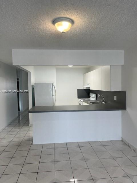 961 West 44th Street Hialeah, FL 33012 - Photo 18 of 35 a view of a kitchen with a sink and cabinets