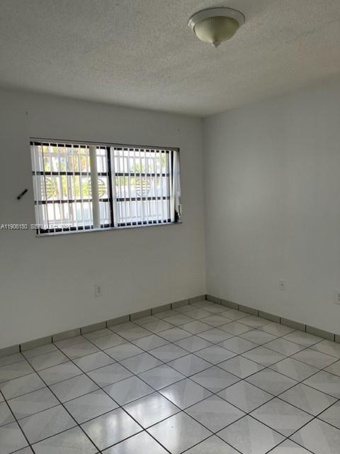961 West 44th Street Hialeah, FL 33012 - Photo 22 of 35 an empty room with a window