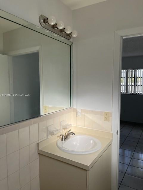 961 West 44th Street Hialeah, FL 33012 - Photo 28 of 35 a bathroom with a sink and a mirror