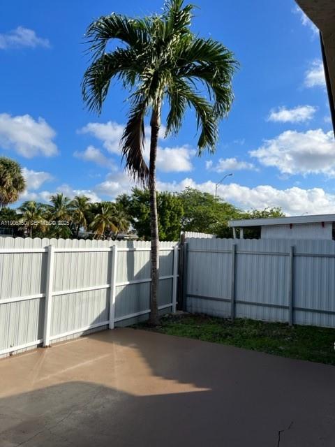 961 West 44th Street Hialeah, FL 33012 - Photo 30 of 35 a view of a palm tree next to a yard