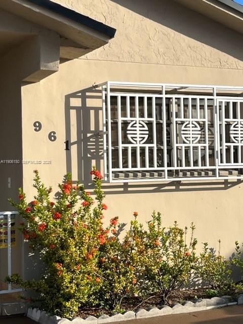 961 West 44th Street Hialeah, FL 33012 - Photo 3 of 35 a front view of a house with a garden