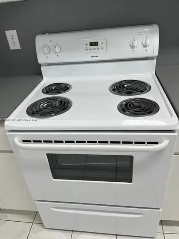 a view of a hallway with wooden floor and closet