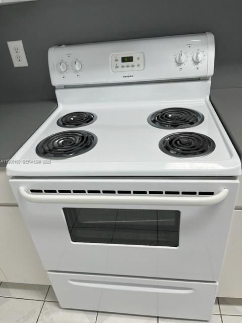 961 West 44th Street Hialeah, FL 33012 - Photo 6 of 35 a close view of stove and microwave