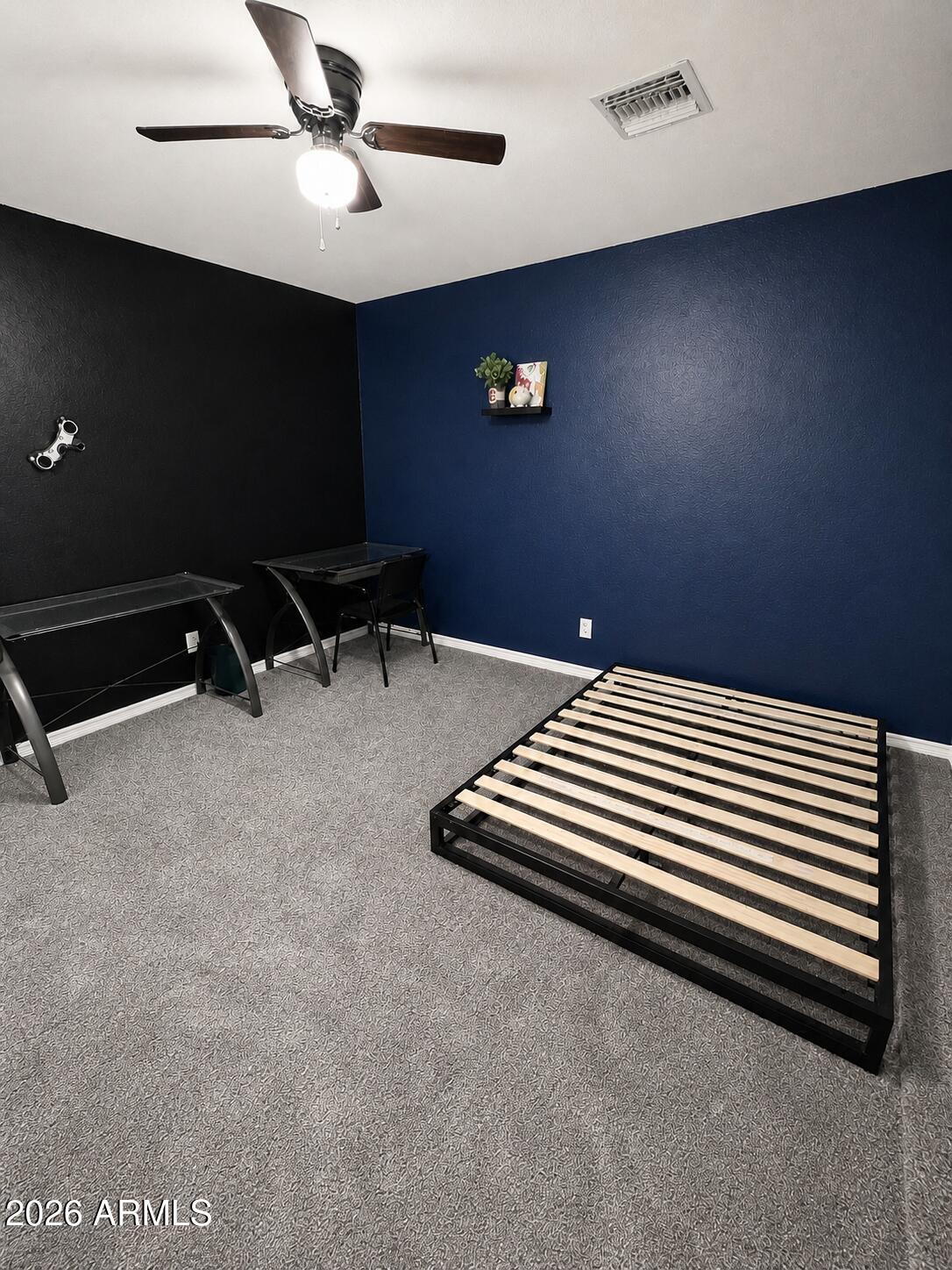 1307 West Mesquite Street Chandler, AZ 85224 - Photo 24 of 36 a bedroom with a bed and a chandelier