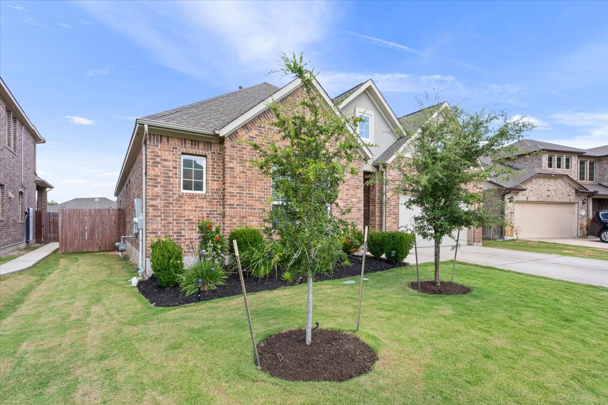 424 Millard Street Georgetown, TX 78628 - Photo 2 of 37 Fresh landscaping and well maintained lawn.