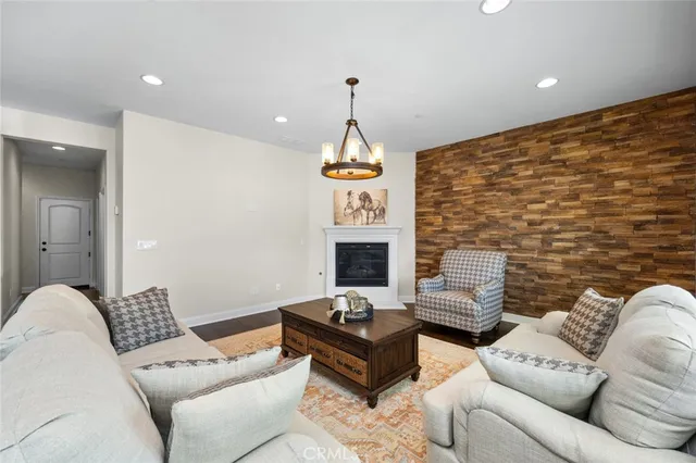 a living room with furniture fireplace and window