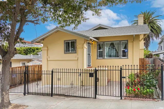 a view of a house with a small yard and plants