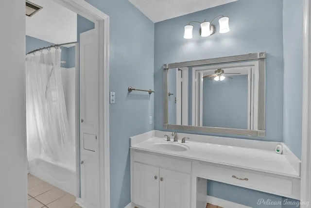 a bathroom with a sink double vanity and a mirror