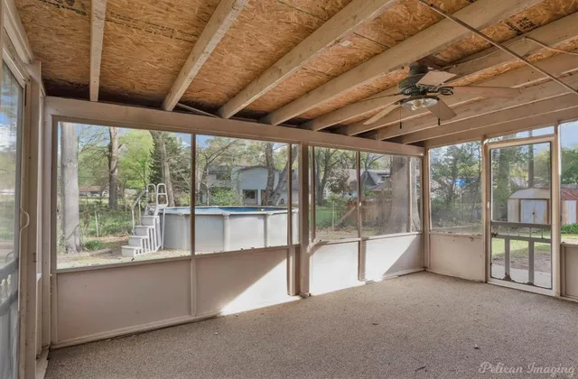 a view of an empty room with a balcony