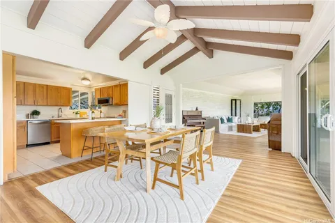 a view of a dining hall with furniture and wooden floor