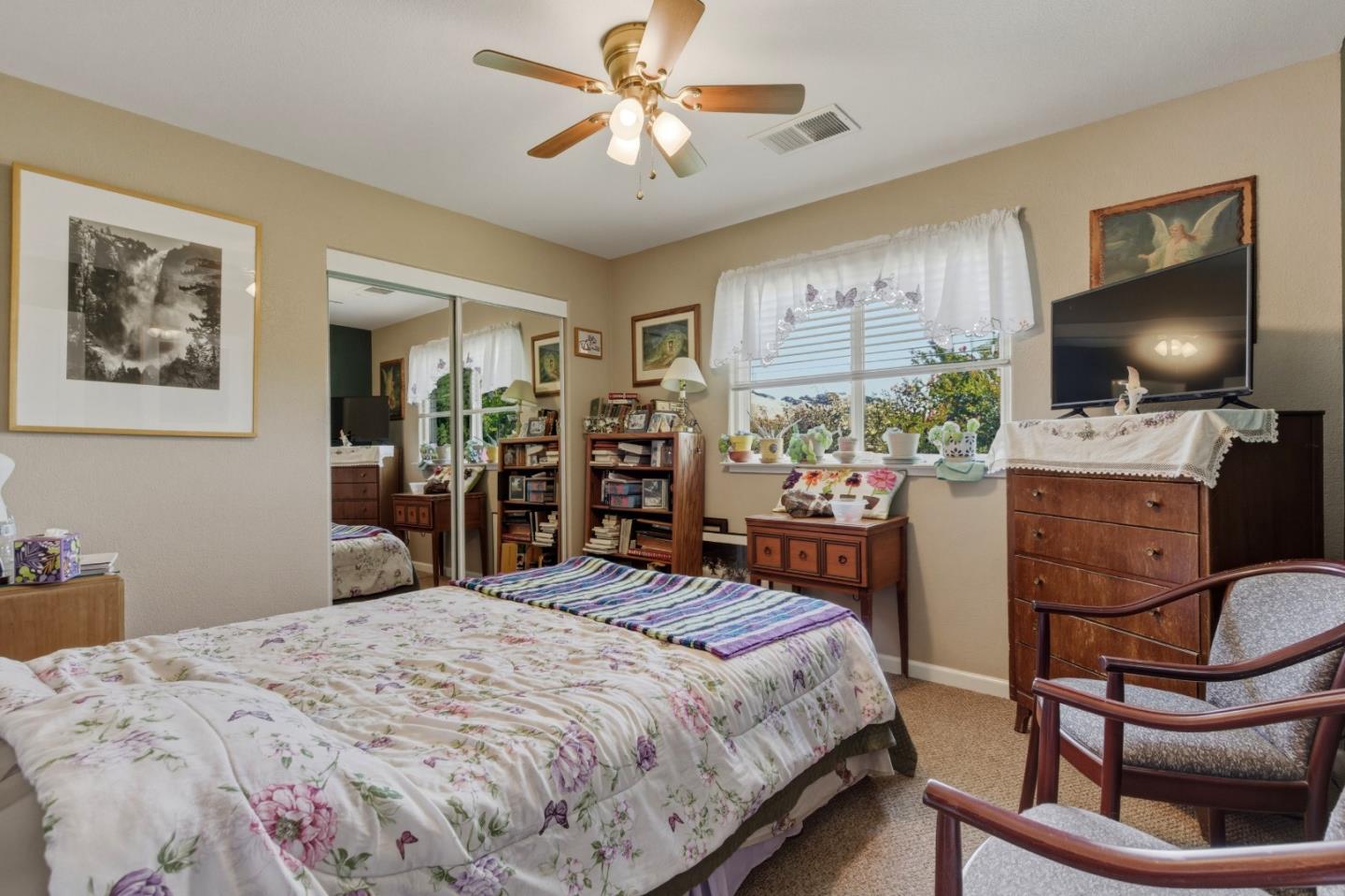 38780 Dinosaur Point Road Hollister, CA 95023 - Photo 7 of 34 a bedroom with a bed and a flat screen tv