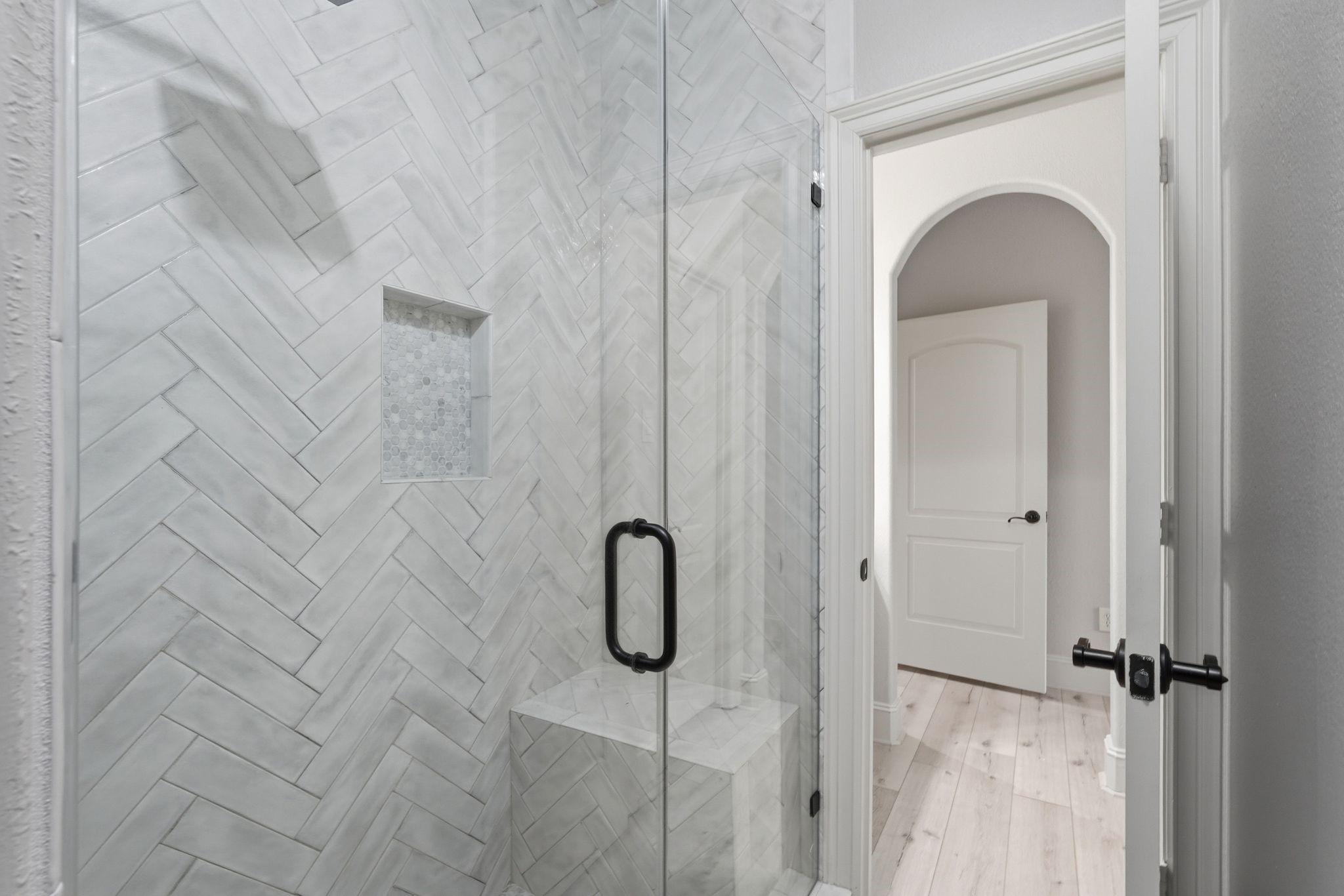 7603 Hogan Bridge Court Spring, TX 77389 - Photo 35 of 50 The glass-enclosed shower enhances the shared bathroom with a bright and open feel.