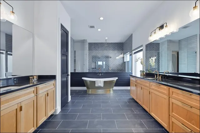 a large kitchen with kitchen island a sink counter space and living room