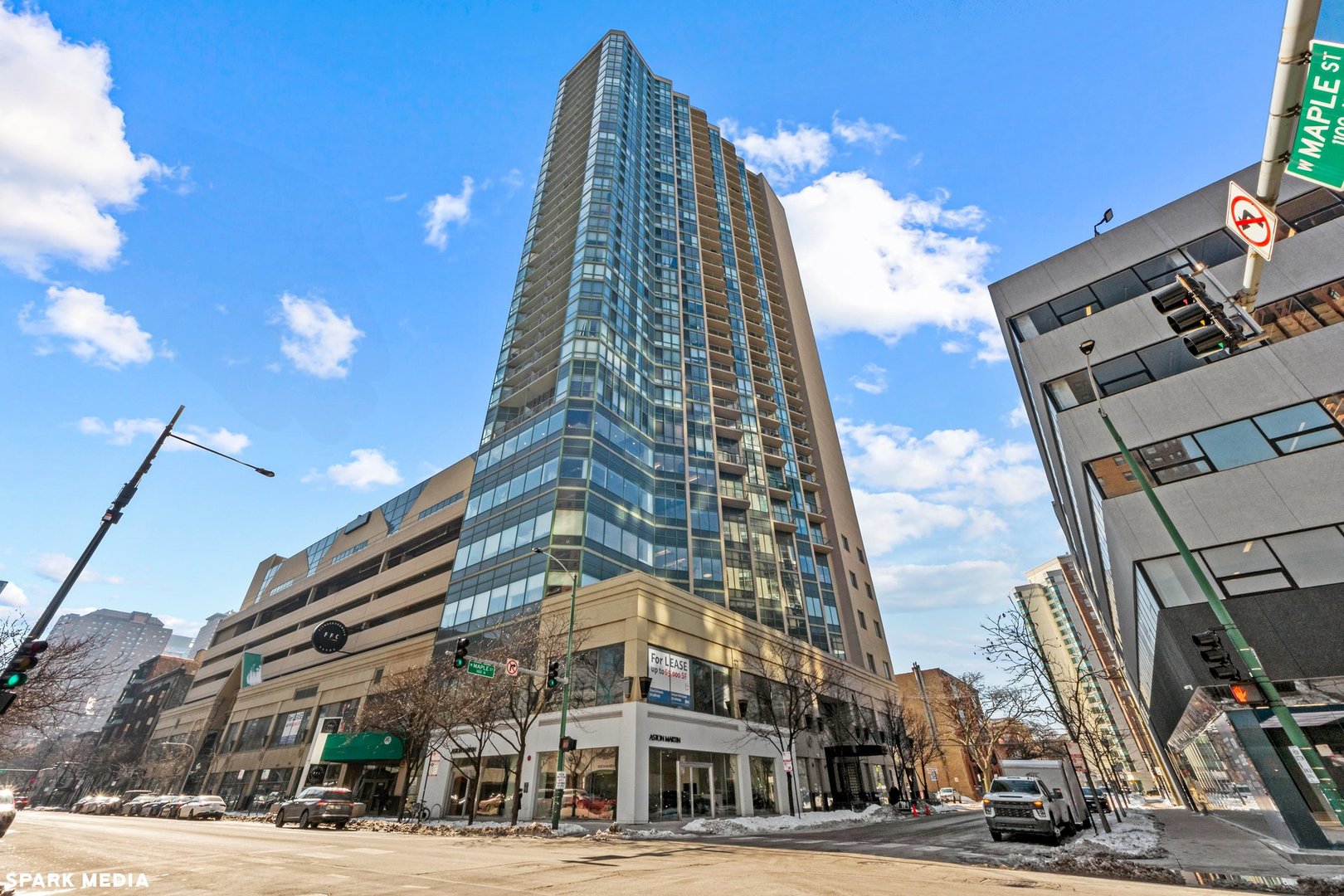 111 West Maple Street, Unit 1009 Chicago, IL 60610 - Photo 1 of 18 a view of a tall building next to a road