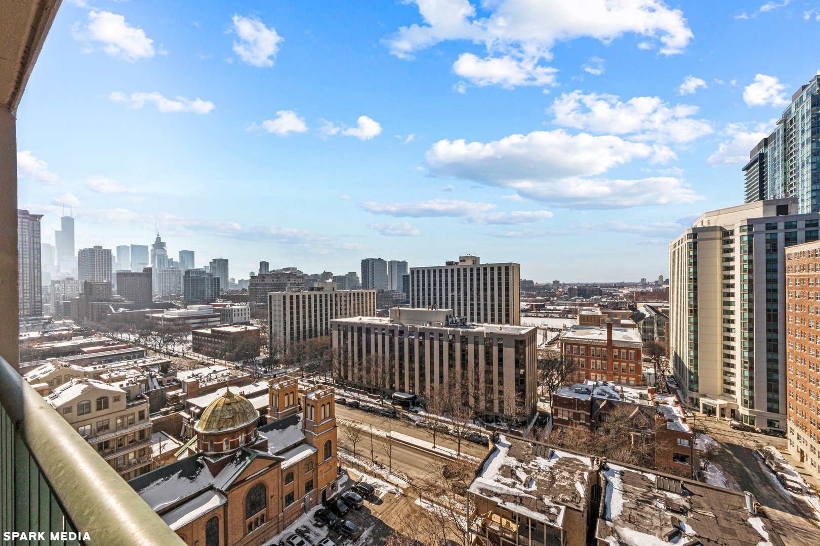 111 West Maple Street, Unit 1009 Chicago, IL 60610 - Photo 12 of 18 a view of a city with tall buildings