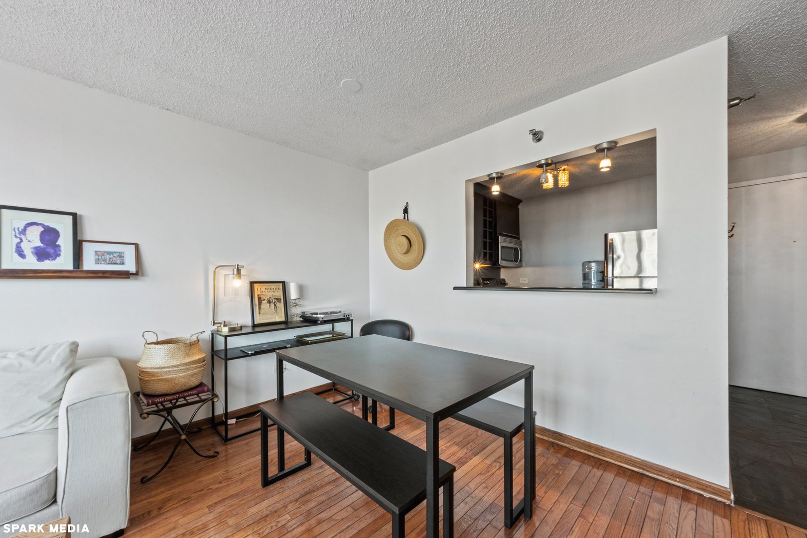111 West Maple Street, Unit 1009 Chicago, IL 60610 - Photo 4 of 18 a workspace with furniture and wooden floor