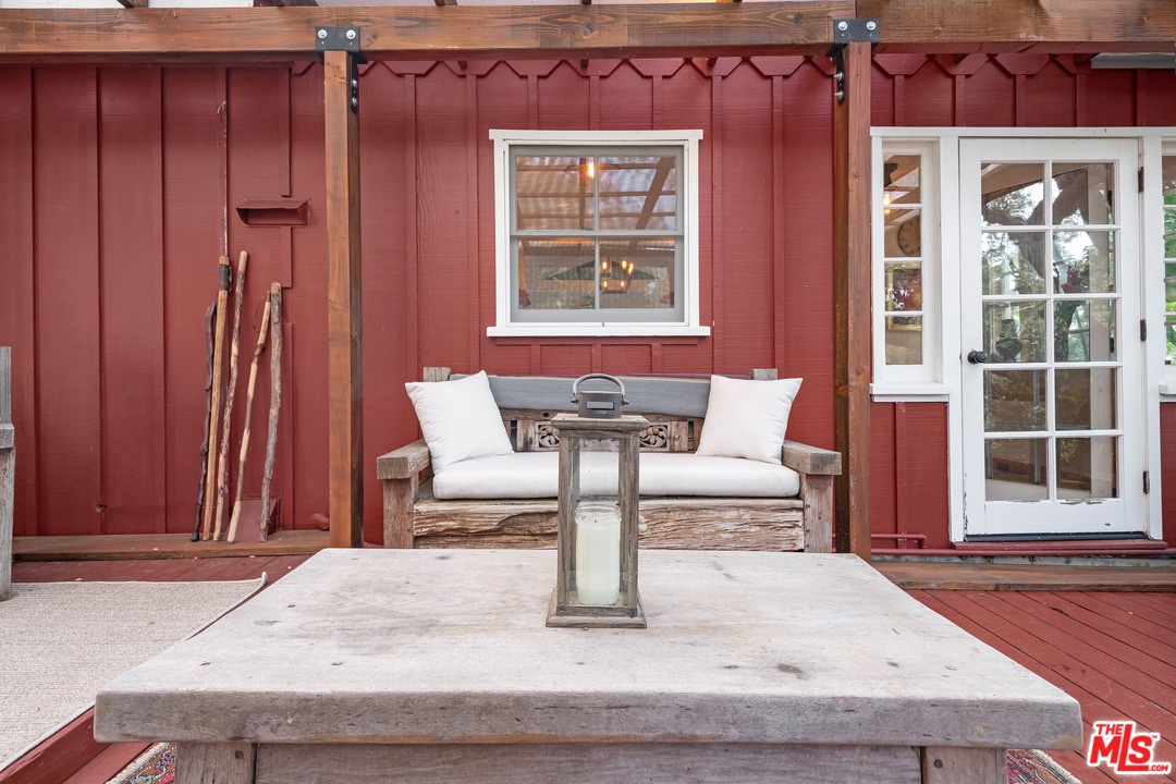 21042 Entrada Road Topanga, CA 90290 - Photo 13 of 49 a living room with furniture and a window