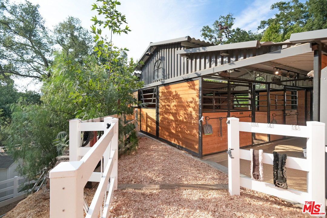 21042 Entrada Road Topanga, CA 90290 - Photo 15 of 49 a view of a chairs and table in the balcony