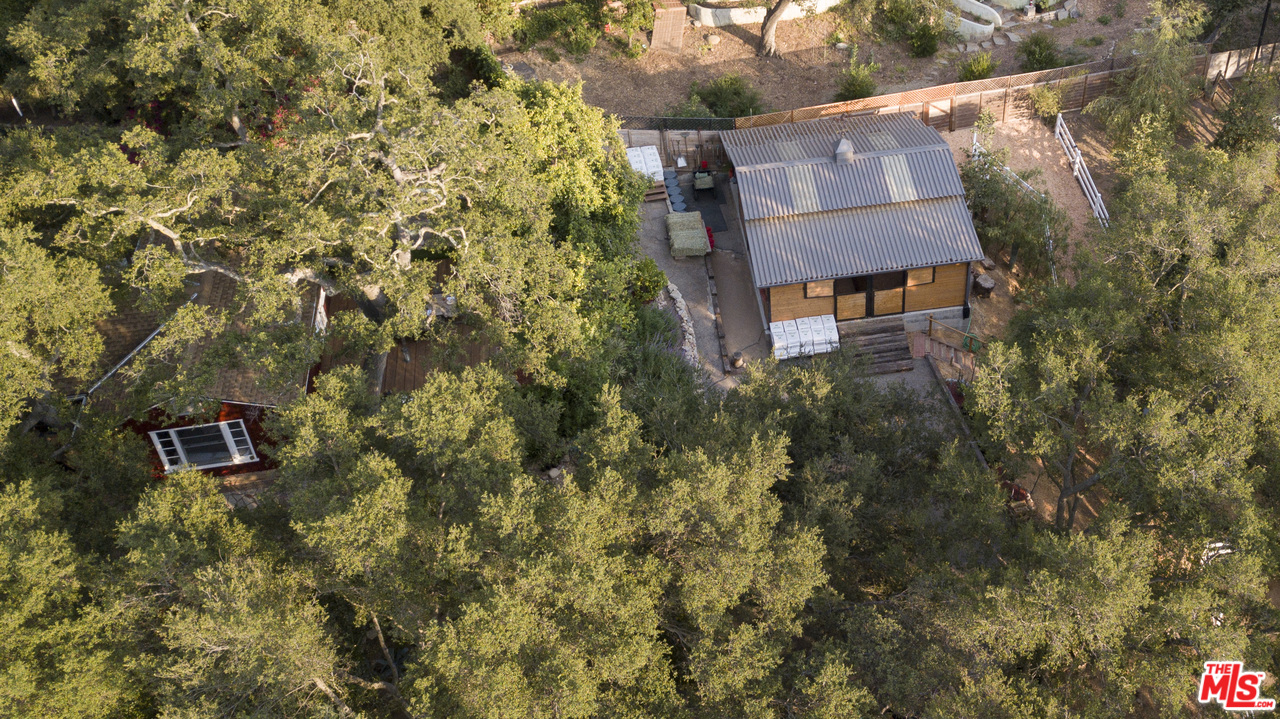 21042 Entrada Road Topanga, CA 90290 - Photo 17 of 49 a view of a house with a yard and sitting area