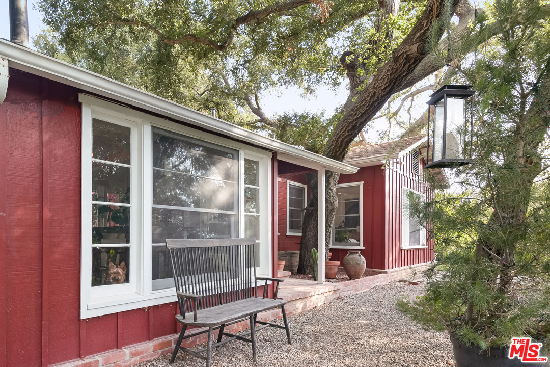 21042 Entrada Road Topanga, CA 90290 - Photo 23 of 49 a view of a chair and table in the balcony