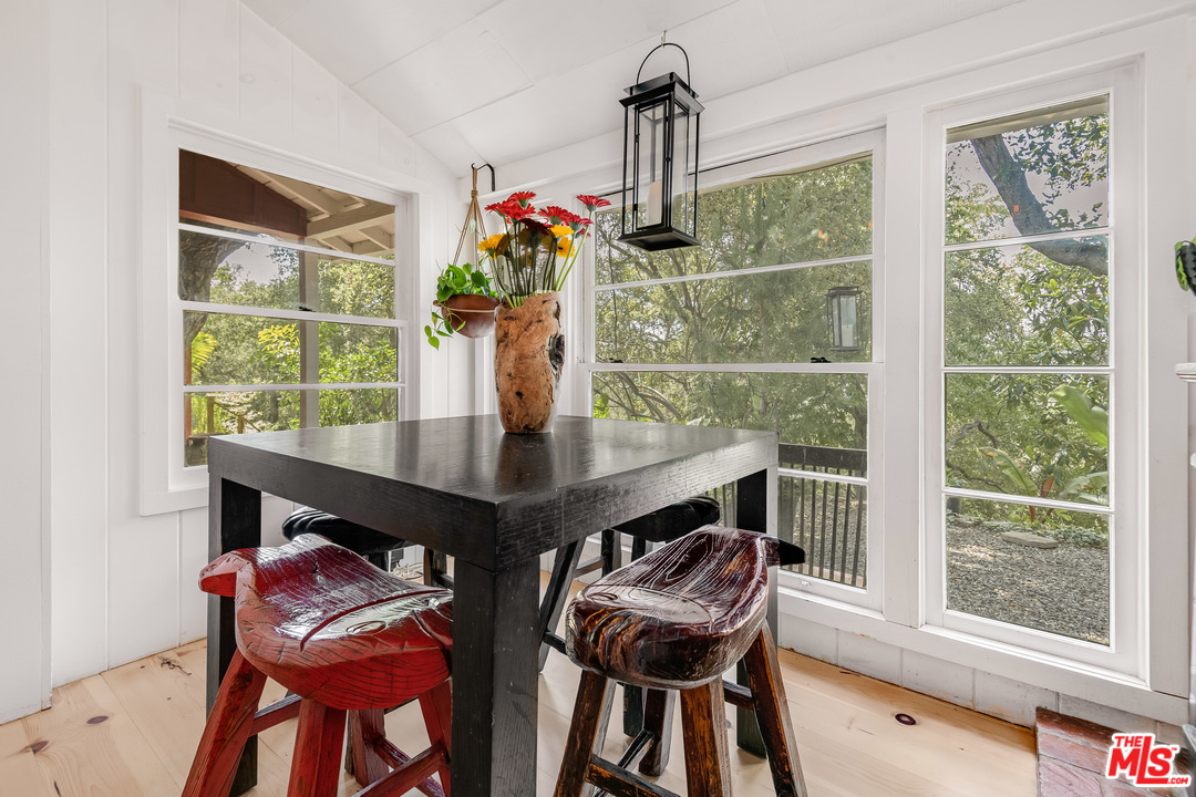 21042 Entrada Road Topanga, CA 90290 - Photo 24 of 49 a view of a dining room with furniture window and outside view