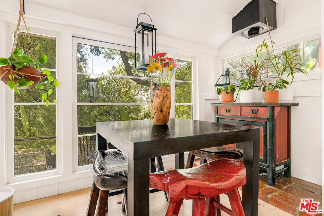 21042 Entrada Road Topanga, CA 90290 - Photo 25 of 49 a view of a dining room with furniture window and outside view