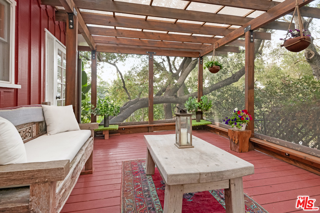 21042 Entrada Road Topanga, CA 90290 - Photo 27 of 49 a living room with furniture and a large window