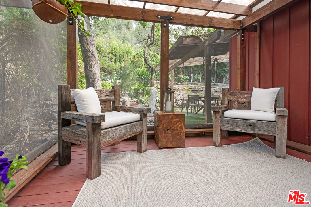 21042 Entrada Road Topanga, CA 90290 - Photo 28 of 49 a living room with furniture and a window