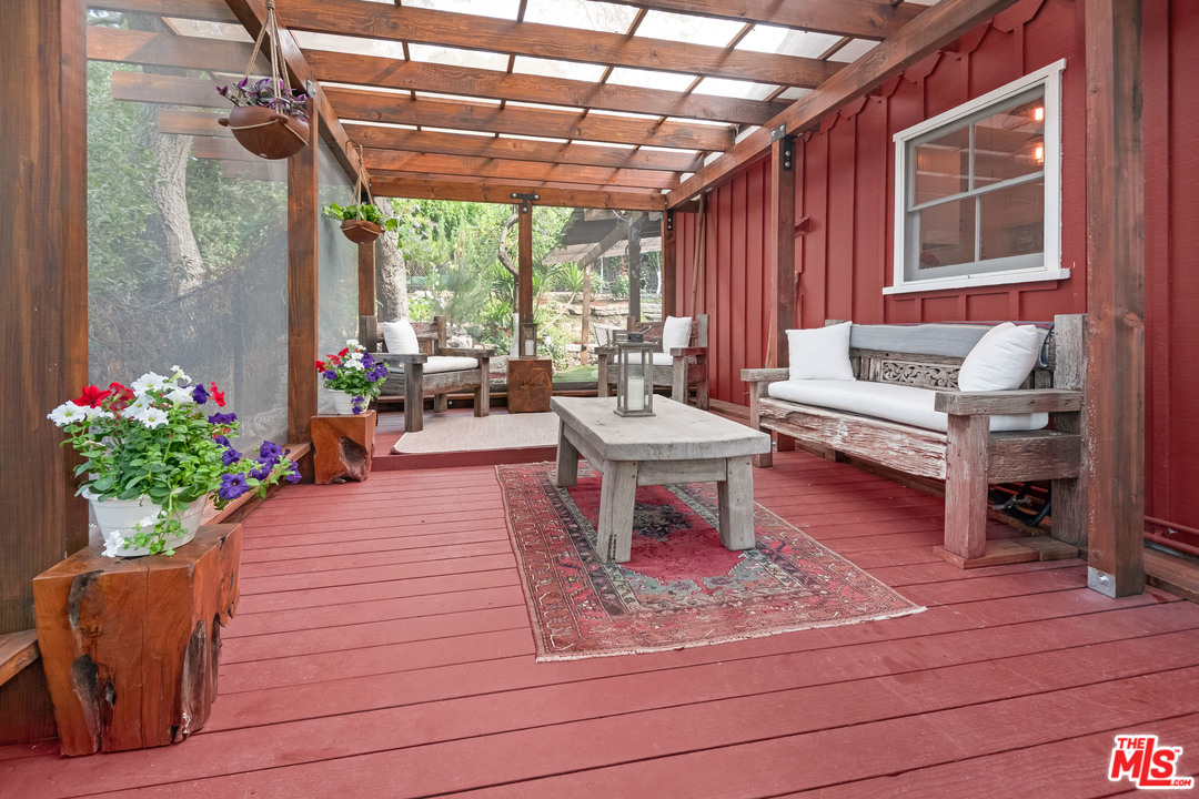 21042 Entrada Road Topanga, CA 90290 - Photo 29 of 49 a living room with patio furniture and a potted plant
