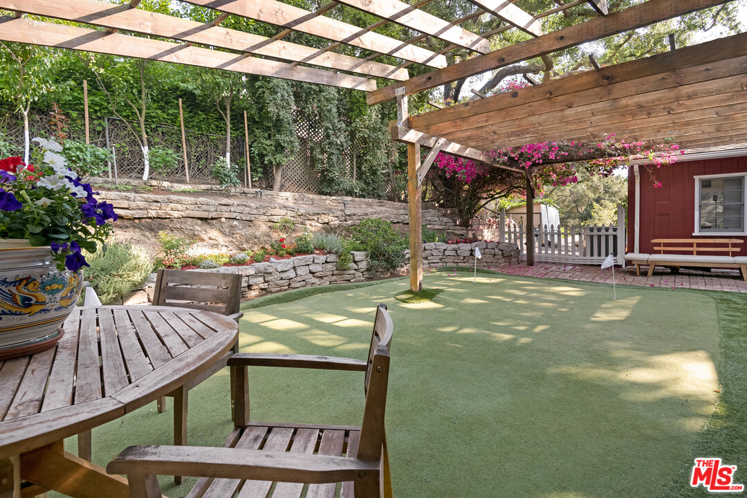 21042 Entrada Road Topanga, CA 90290 - Photo 30 of 49 a view of a house with swimming pool and sitting area