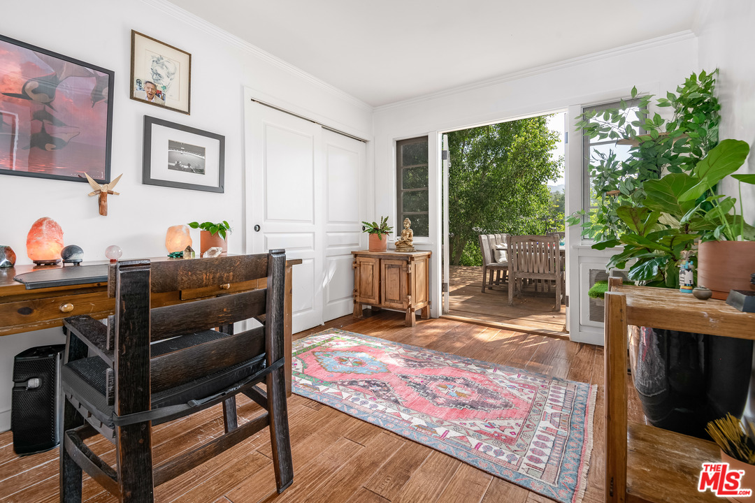 21042 Entrada Road Topanga, CA 90290 - Photo 31 of 49 a living room with furniture a window and a fireplace