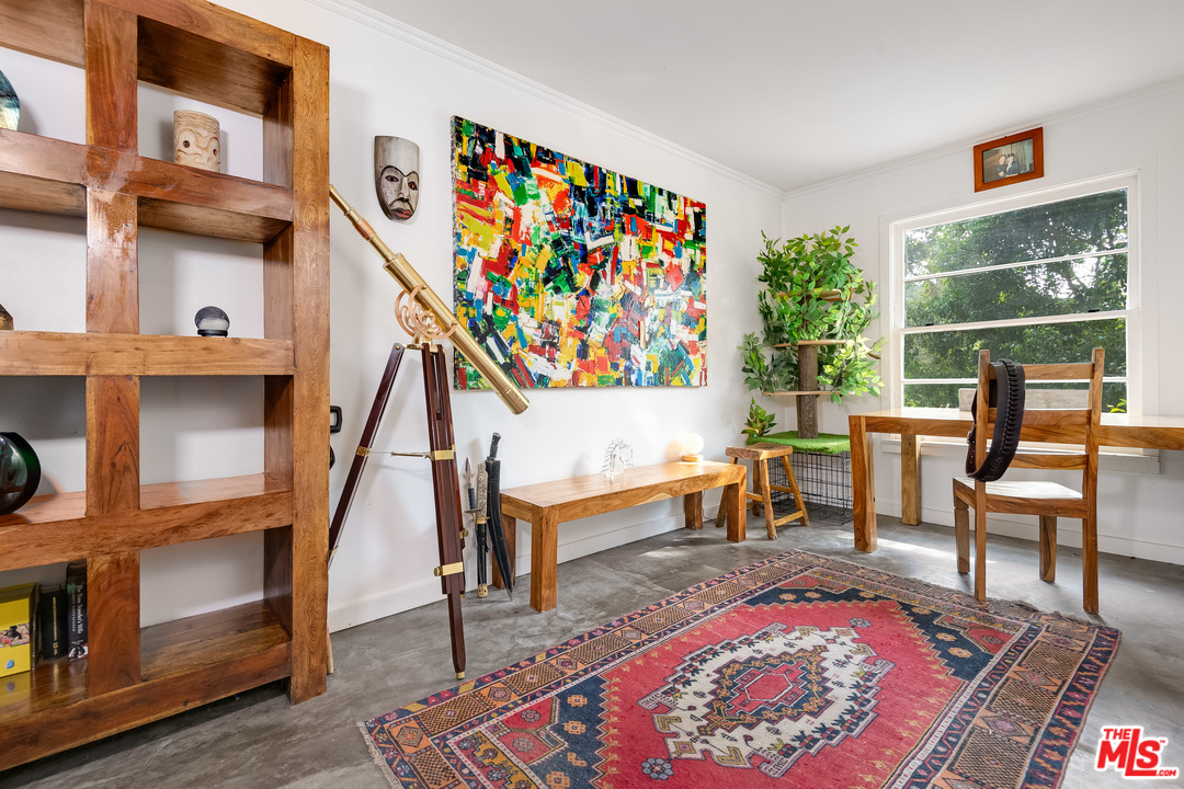 21042 Entrada Road Topanga, CA 90290 - Photo 33 of 49 a living room with furniture and a rug