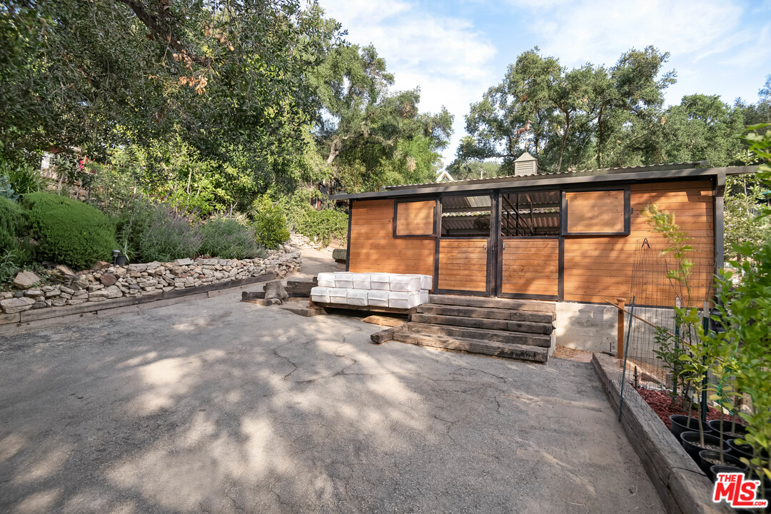 21042 Entrada Road Topanga, CA 90290 - Photo 36 of 49 a view of backyard with outdoor seating and plants