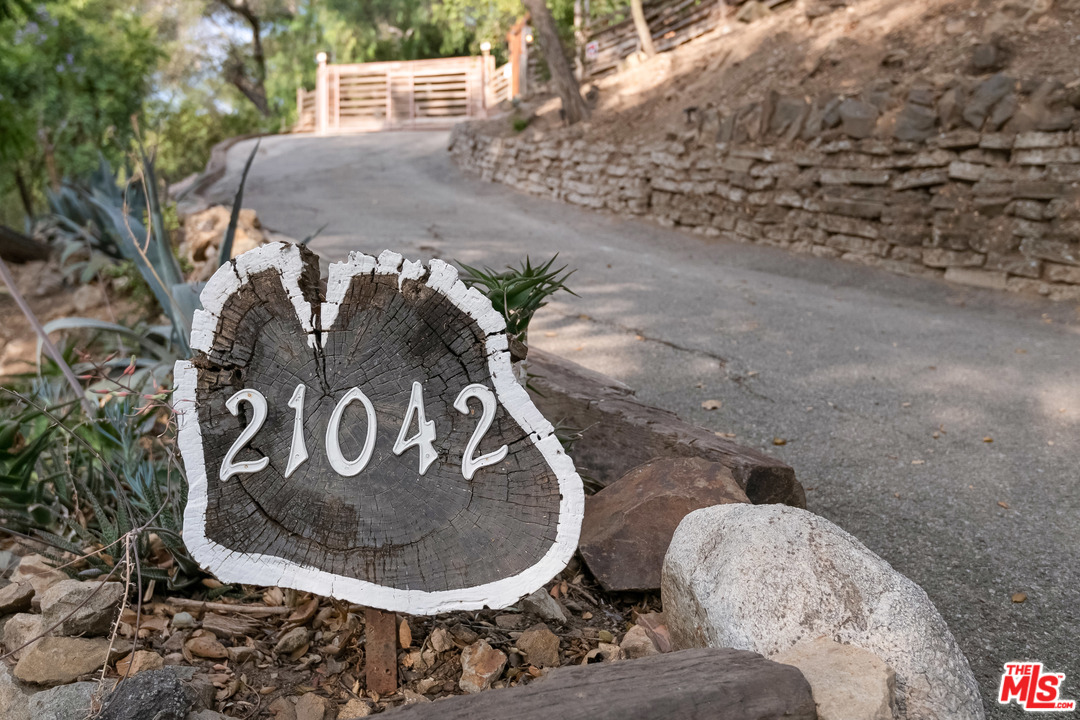 21042 Entrada Road Topanga, CA 90290 - Photo 40 of 49 a sign that is sitting on a floor