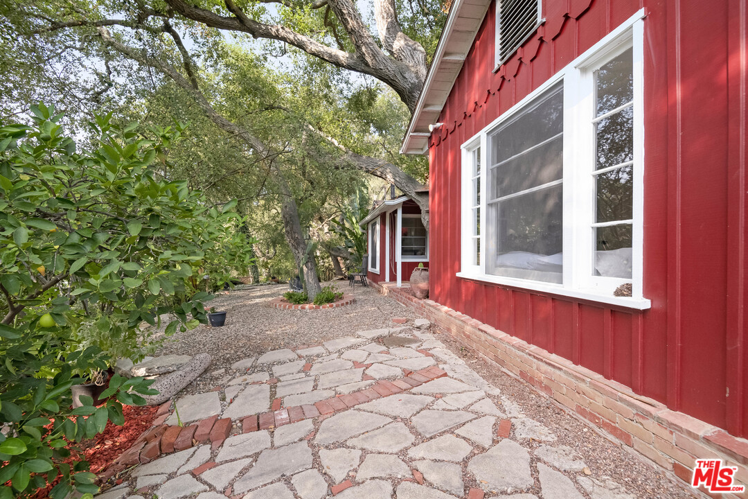 21042 Entrada Road Topanga, CA 90290 - Photo 44 of 49 a view of a house with a yard