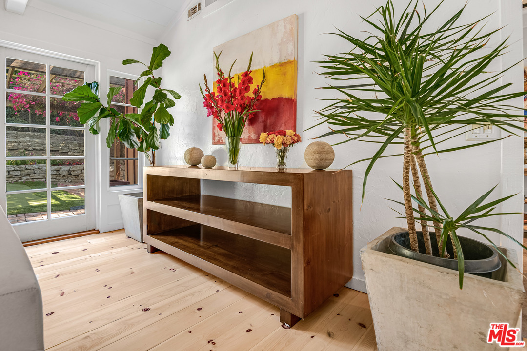 21042 Entrada Road Topanga, CA 90290 - Photo 45 of 49 a view of a vase of flowers sitting on a table in front of a window