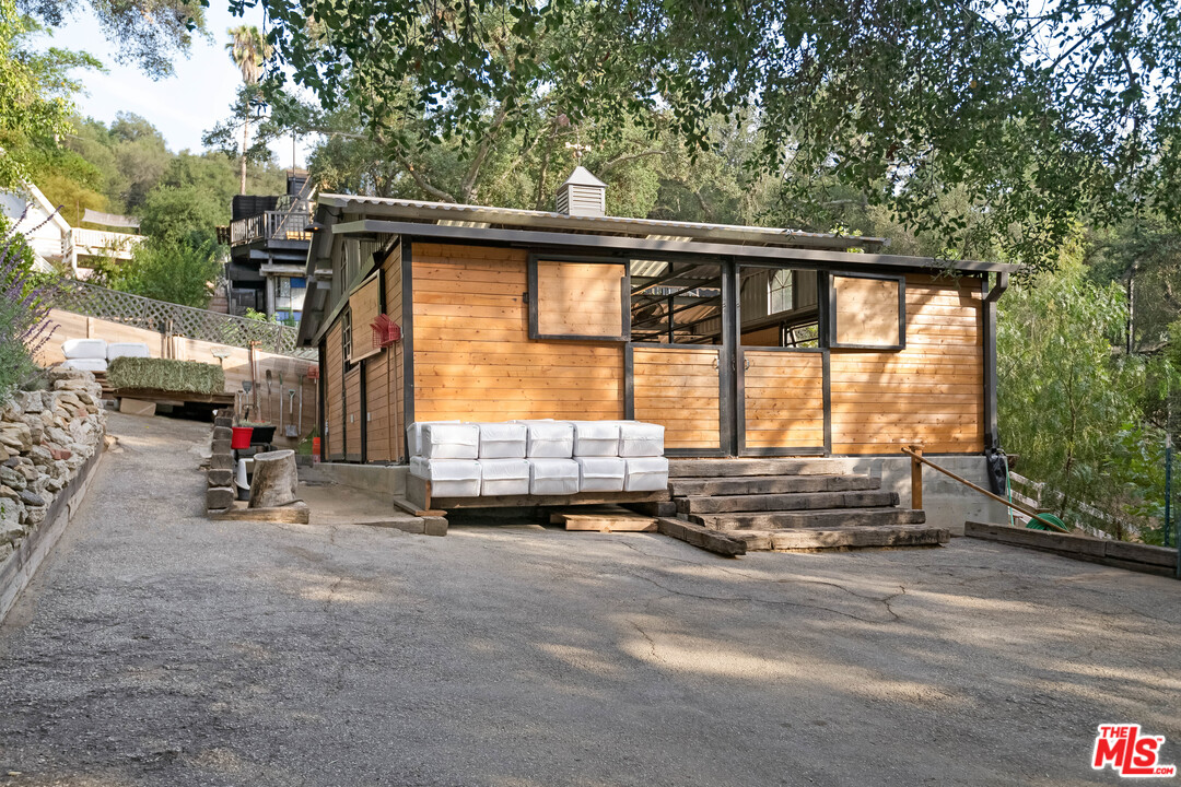 21042 Entrada Road Topanga, CA 90290 - Photo 47 of 49 a car parked in front of a house