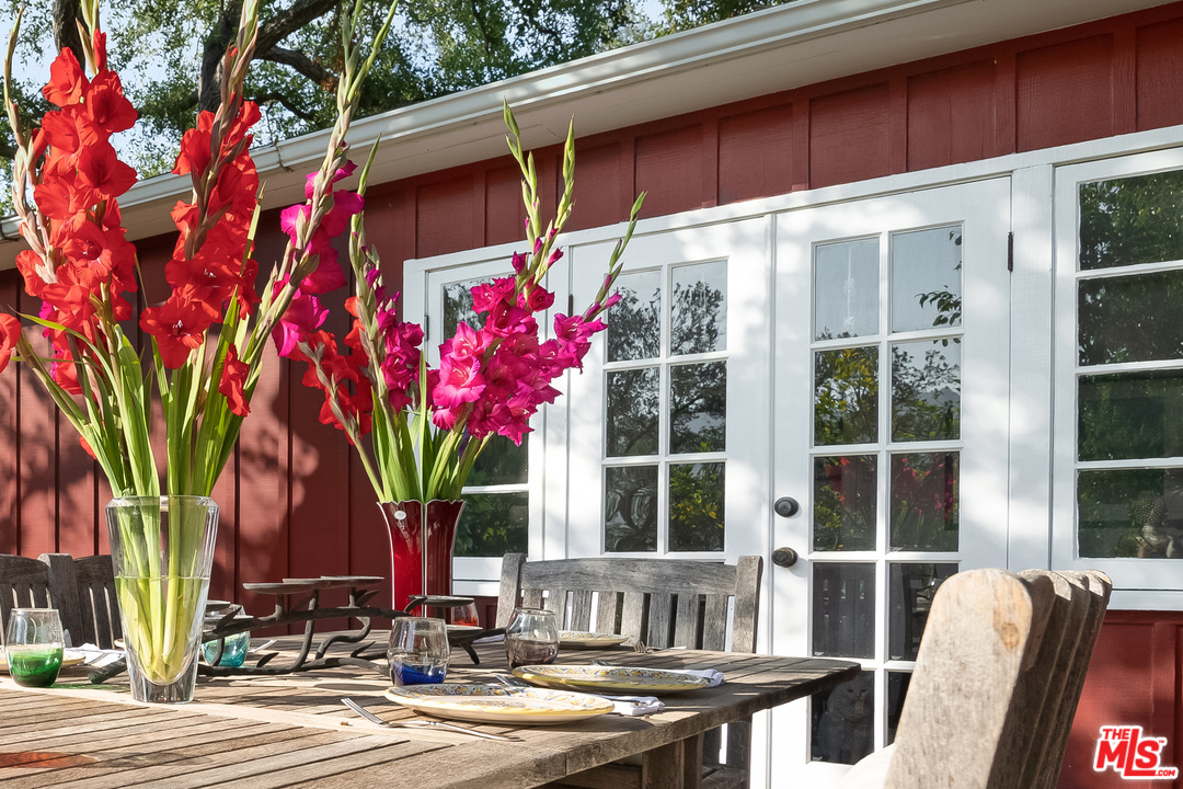 21042 Entrada Road Topanga, CA 90290 - Photo 7 of 49 a front view of a house with a yard