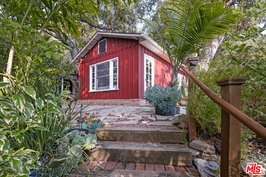 21042 Entrada Road Topanga, CA 90290 - Photo 8 of 49 a view of a house with a yard