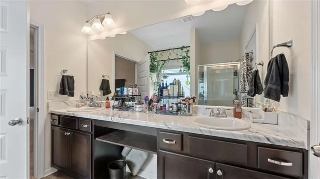 a bathroom with a bathtub and shower