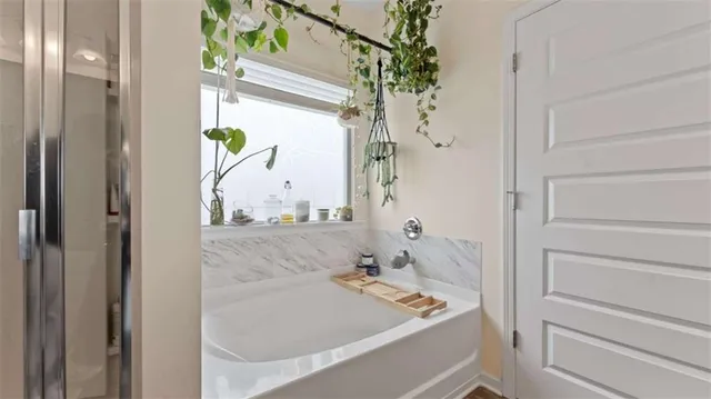 a bedroom with a bed and flat screen tv