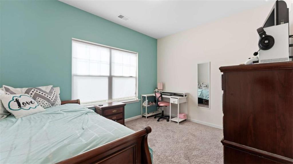 13 Oak View Drive Northeast Rome, GA 30165 - Photo 16 of 26 a bedroom with a bed and a window