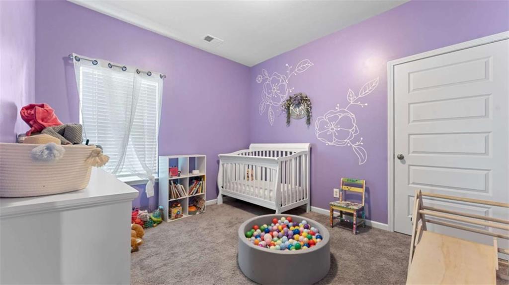 13 Oak View Drive Northeast Rome, GA 30165 - Photo 18 of 26 a bedroom with a bed and a cabinets
