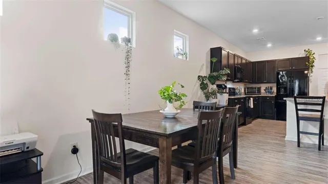 a kitchen with lots of counter top space and dining table