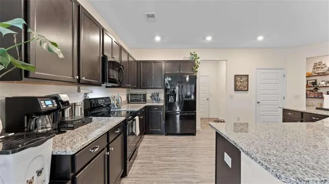 a kitchen with a sink and cabinets